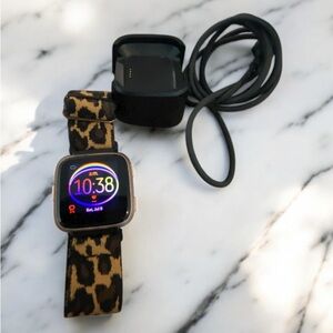 Fitbit Versa Smartwatch with Leopard Print Elastic and Black Charger